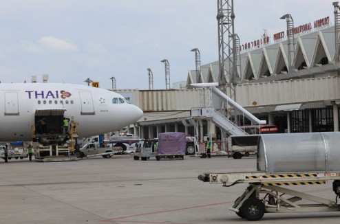 Thai Airways jet loading at Phuket International Airport Thai Airways jet loading at Phuket International Airport
