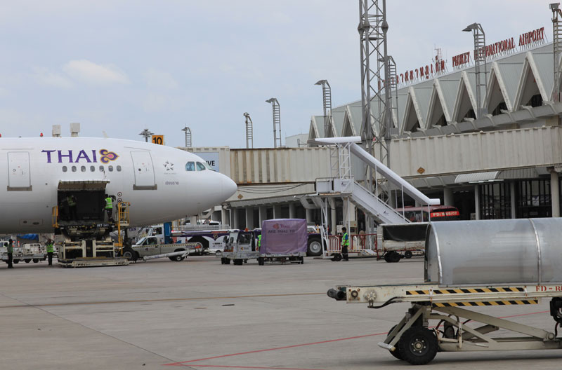 Thai Airways jet loading at Phuket International Airport Thai Airways jet loading at Phuket International Airport